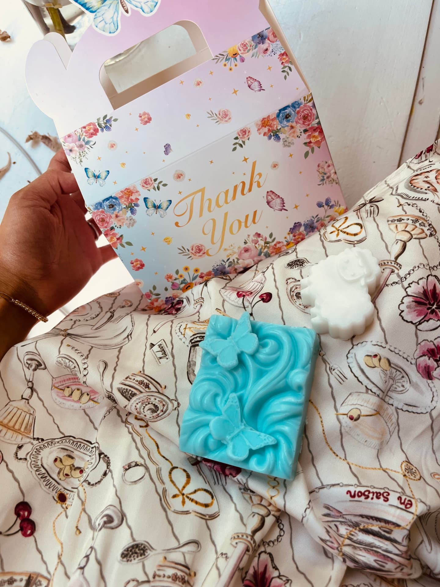 Deep ocean-blue goat milk soap embossed with rolling waves and a butterfly