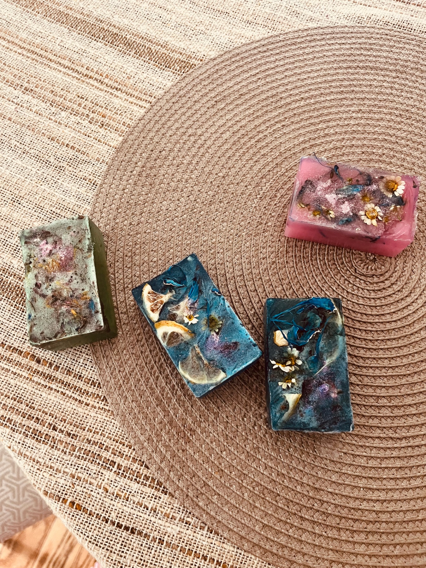 Four handcrafted floral soaps from the Butterfly of Hope studio
